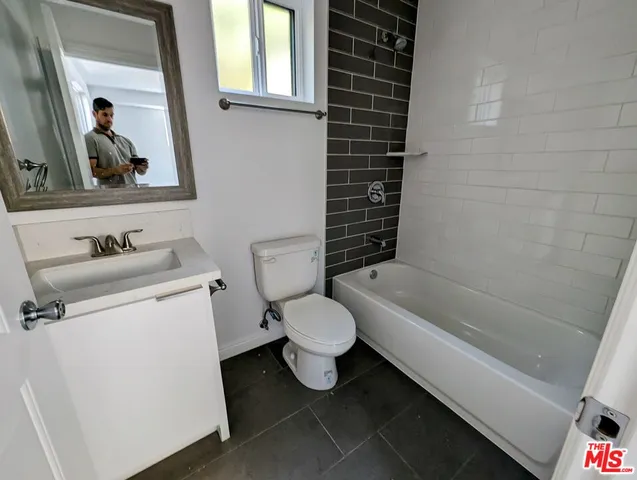 a bathroom with a toilet sink and bathtub