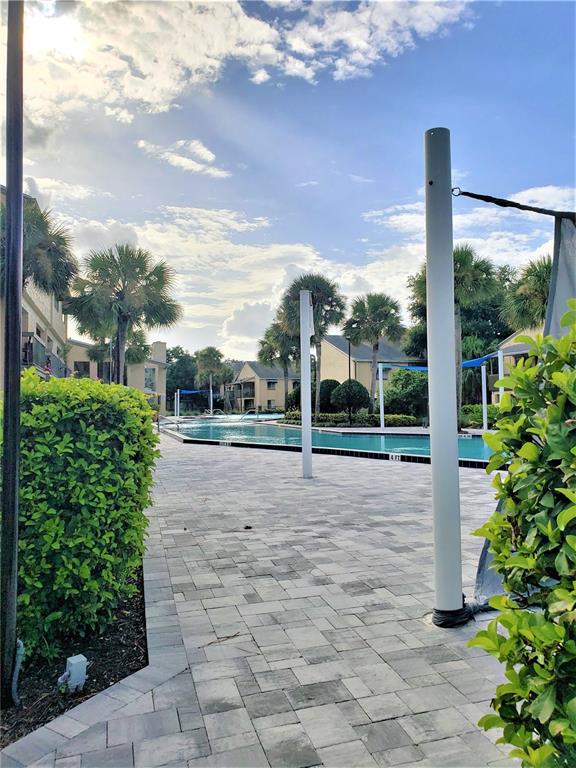 4151 South Semoran Boulevard, Unit 8 Orlando, FL 32822 - Photo 22 of 27 a view of a yard with plants