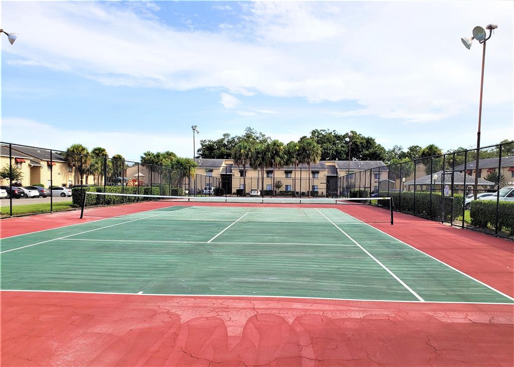 4151 South Semoran Boulevard, Unit 8 Orlando, FL 32822 - Photo 23 of 27 a view of a tennis court