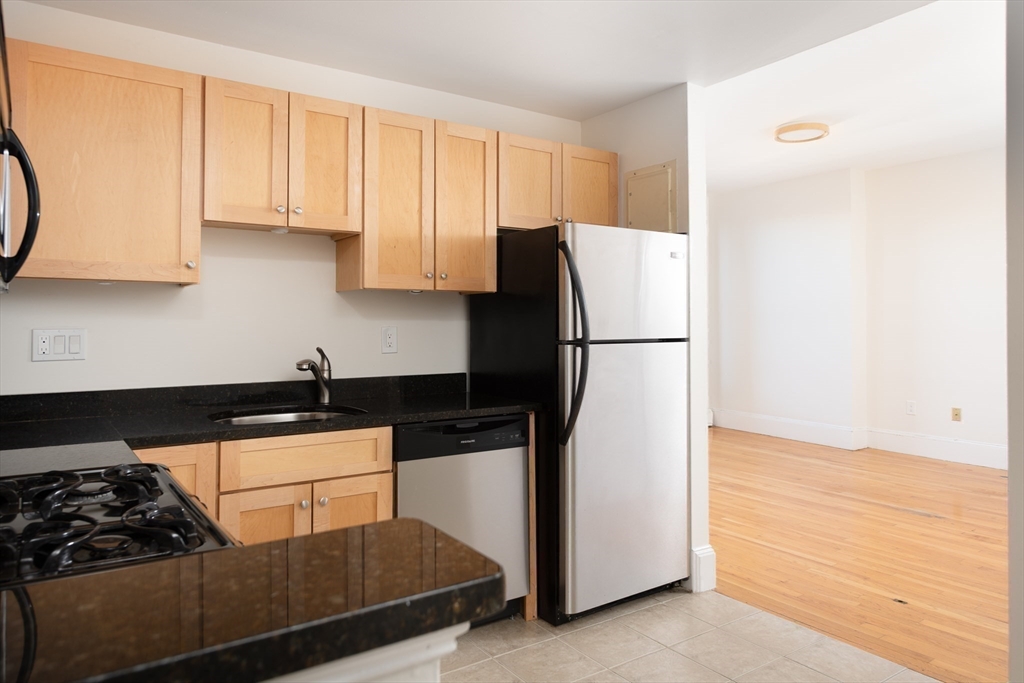 362 Commonwealth Avenue, Unit 4E Boston, MA 02115 - Photo 13 of 19 a kitchen with a refrigerator and a stove