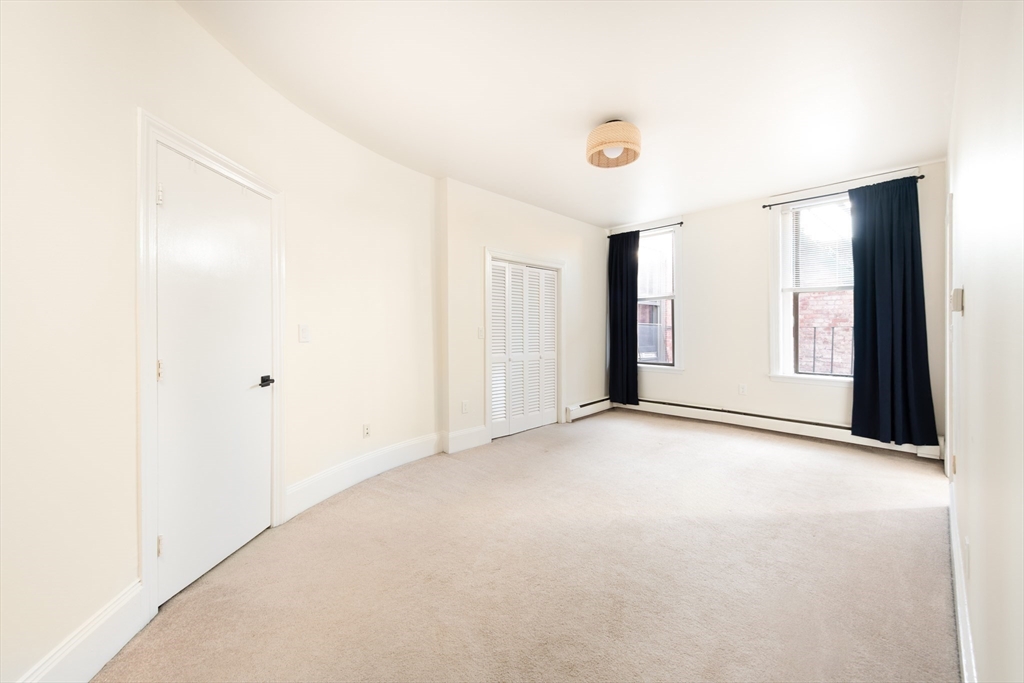 362 Commonwealth Avenue, Unit 4E Boston, MA 02115 - Photo 15 of 19 a view of an empty room with a window