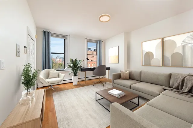 a living room with furniture rug and window