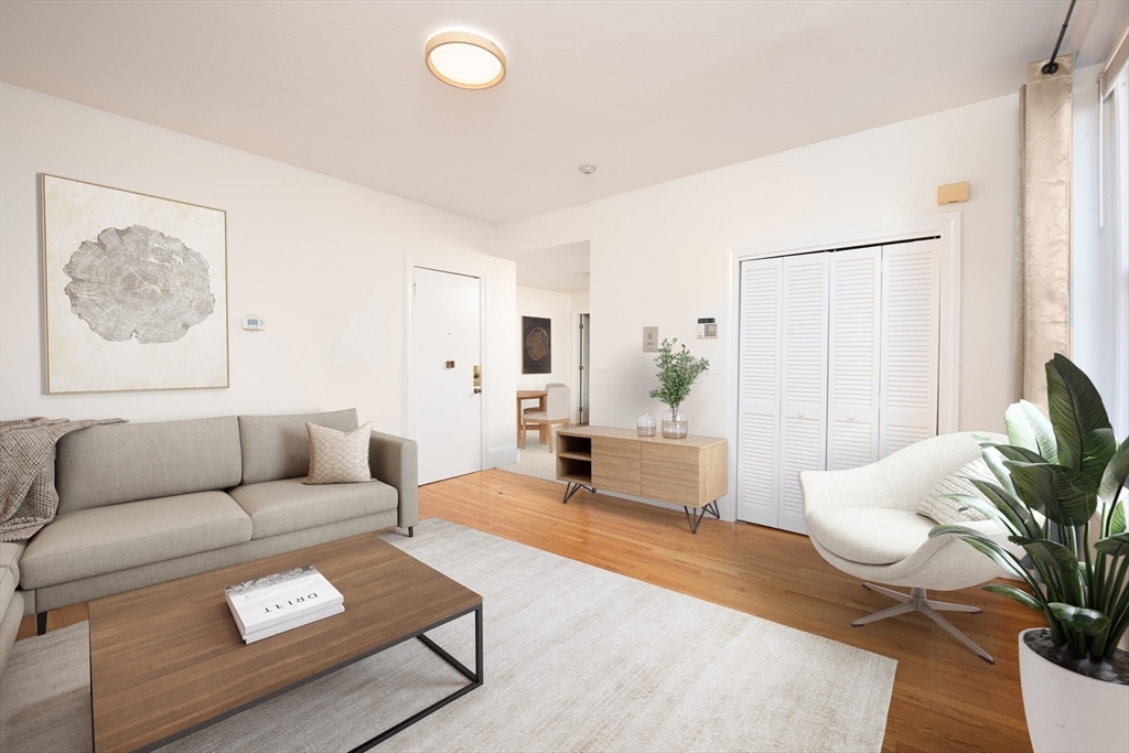 362 Commonwealth Avenue, Unit 4E Boston, MA 02115 - Photo 5 of 19 a living room with furniture and a couch