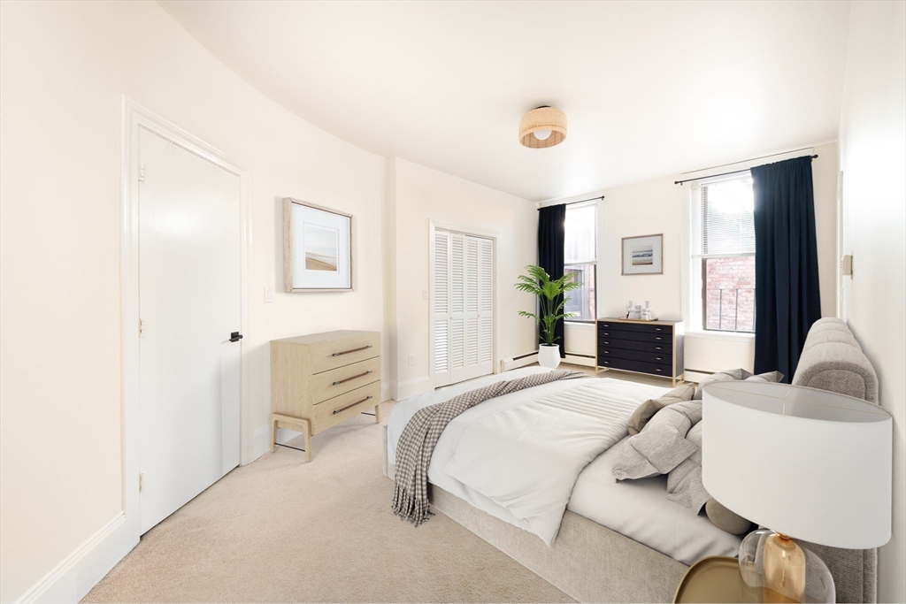 362 Commonwealth Avenue, Unit 4E Boston, MA 02115 - Photo 6 of 19 a bedroom with a bed and a couch