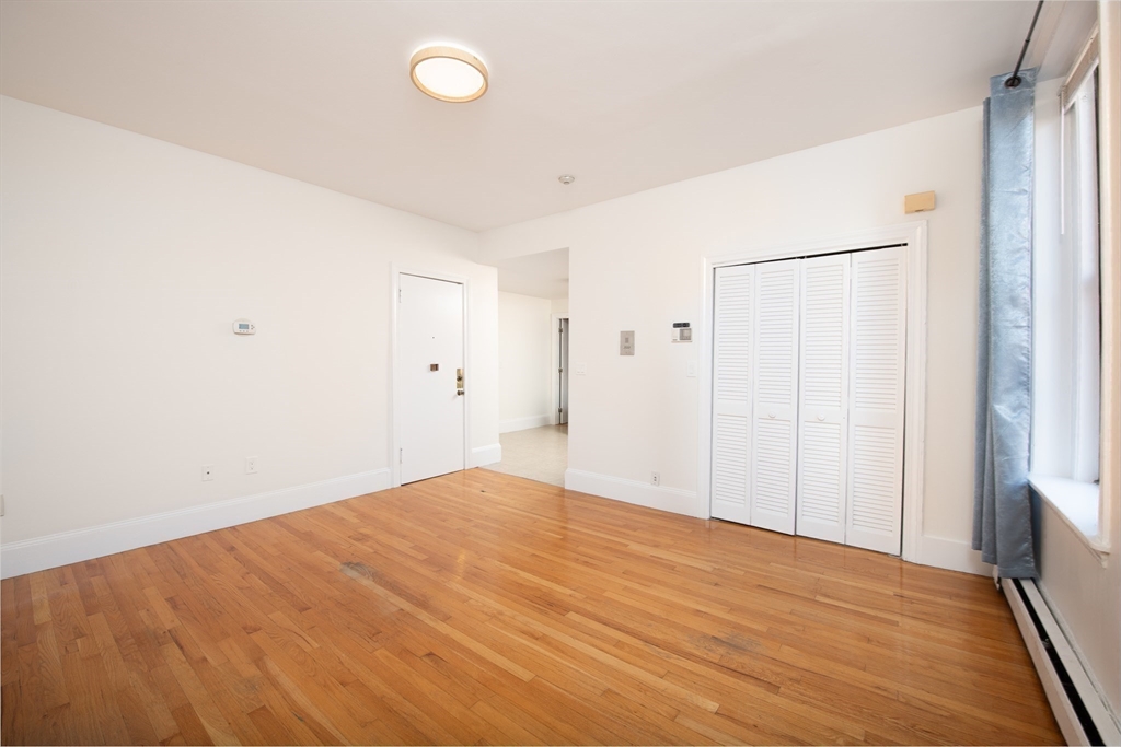 362 Commonwealth Avenue, Unit 4E Boston, MA 02115 - Photo 10 of 19 a view of empty room with wooden floor