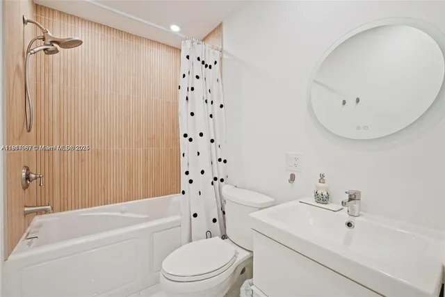 a bathroom with a sink a toilet and a bathtub