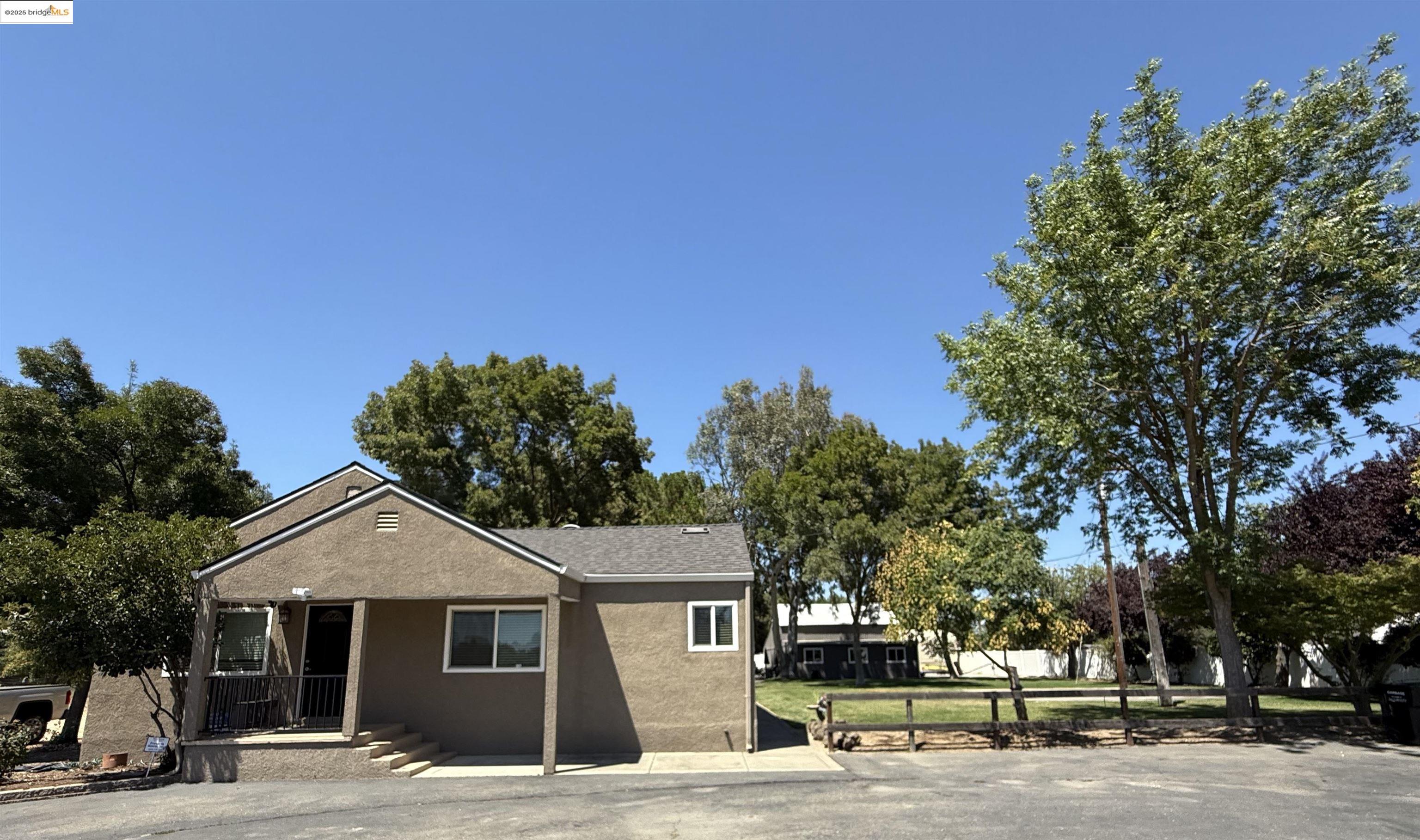 9729 Orr Road Galt, CA 95632 - Photo 1 of 1 a front view of a house with a garden