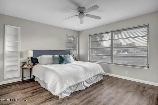 a bedroom with a bed and with view of bathroom