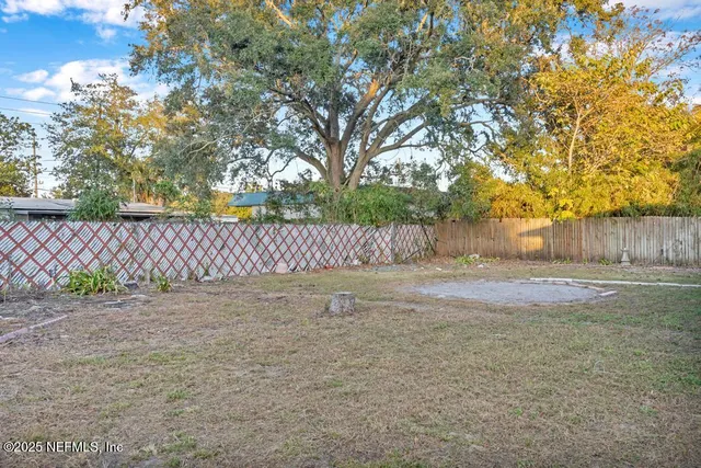 a view of an empty room with windows