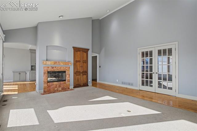 5510 Wilson Road Colorado Springs, CO 80919 - Photo 6 of 44 Living room with view of office with double french doors.