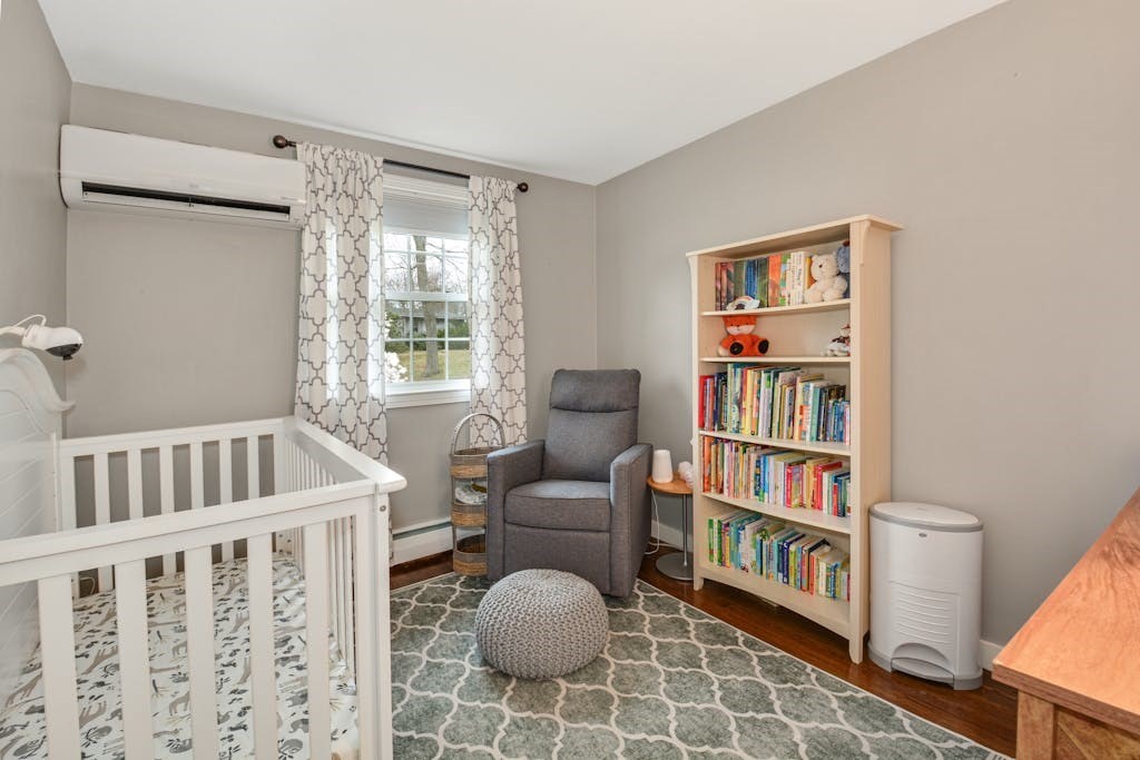 20 Oakview Circle Medway, MA 02053 - Photo 11 of 33 a living room with furniture a bookshelf and a window