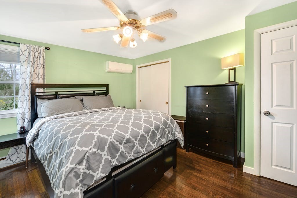 20 Oakview Circle Medway, MA 02053 - Photo 15 of 33 a bedroom with a bed and a chandelier