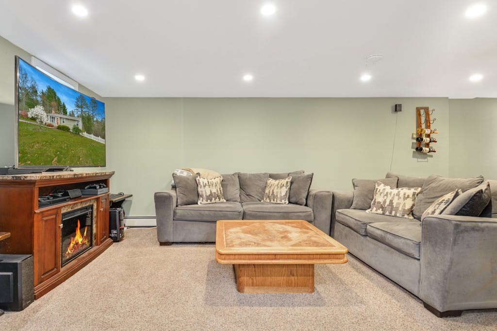 20 Oakview Circle Medway, MA 02053 - Photo 18 of 33 a living room with furniture and a flat screen tv