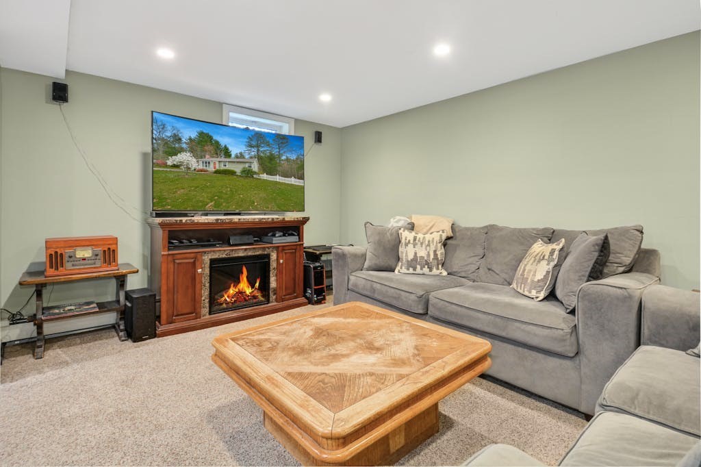 20 Oakview Circle Medway, MA 02053 - Photo 19 of 33 a living room with furniture and a flat screen tv