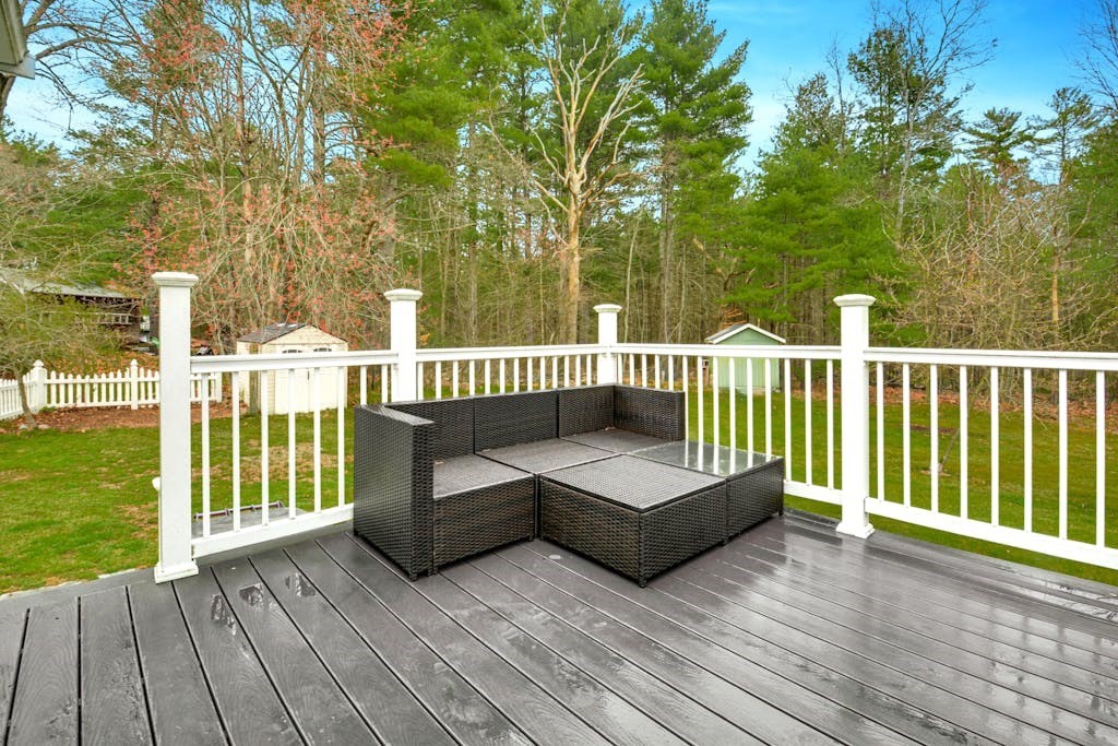 20 Oakview Circle Medway, MA 02053 - Photo 24 of 33 a view of a deck with couches wooden fence and floor