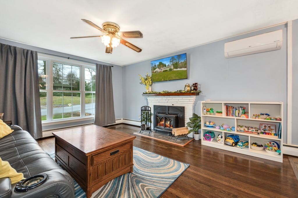 20 Oakview Circle Medway, MA 02053 - Photo 6 of 33 a living room with furniture and a fireplace