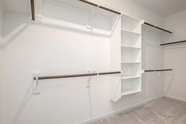 a view of an empty walk in closet