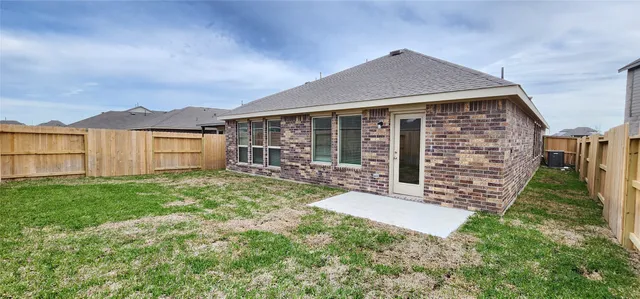 a brick house with a yard
