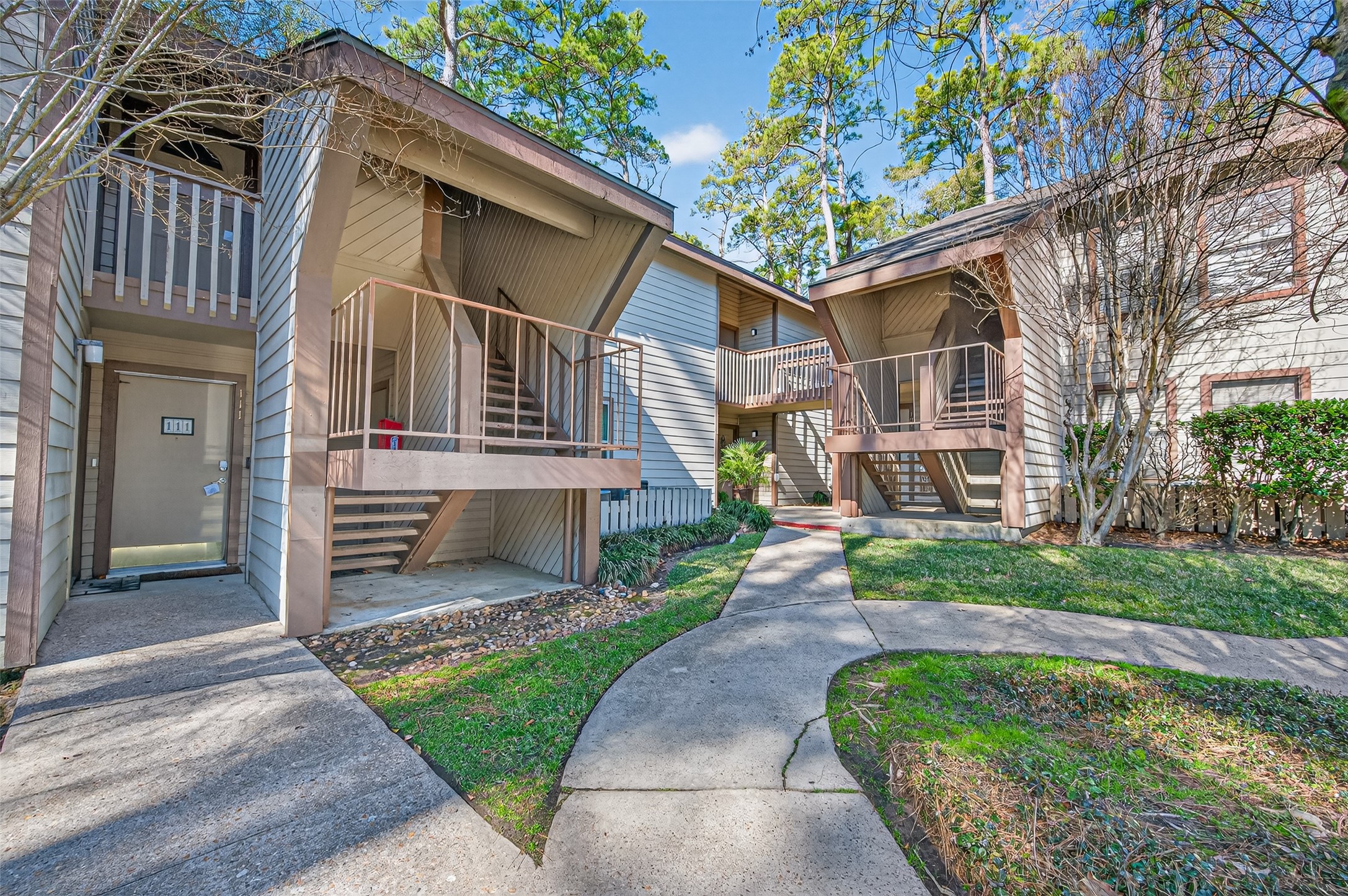 12900 Walden Road, Unit 108A Montgomery, TX 77356 - Photo 1 of 42 a front view of a house with garden