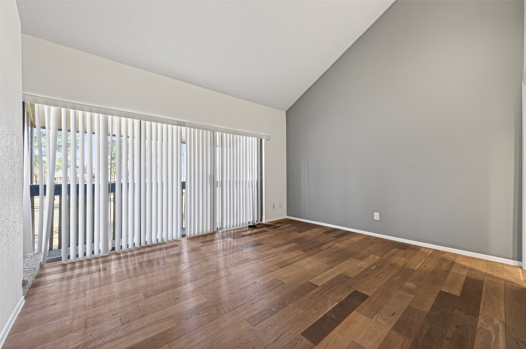 12900 Walden Road, Unit 108A Montgomery, TX 77356 - Photo 16 of 42 a view of an empty room with wooden floor
