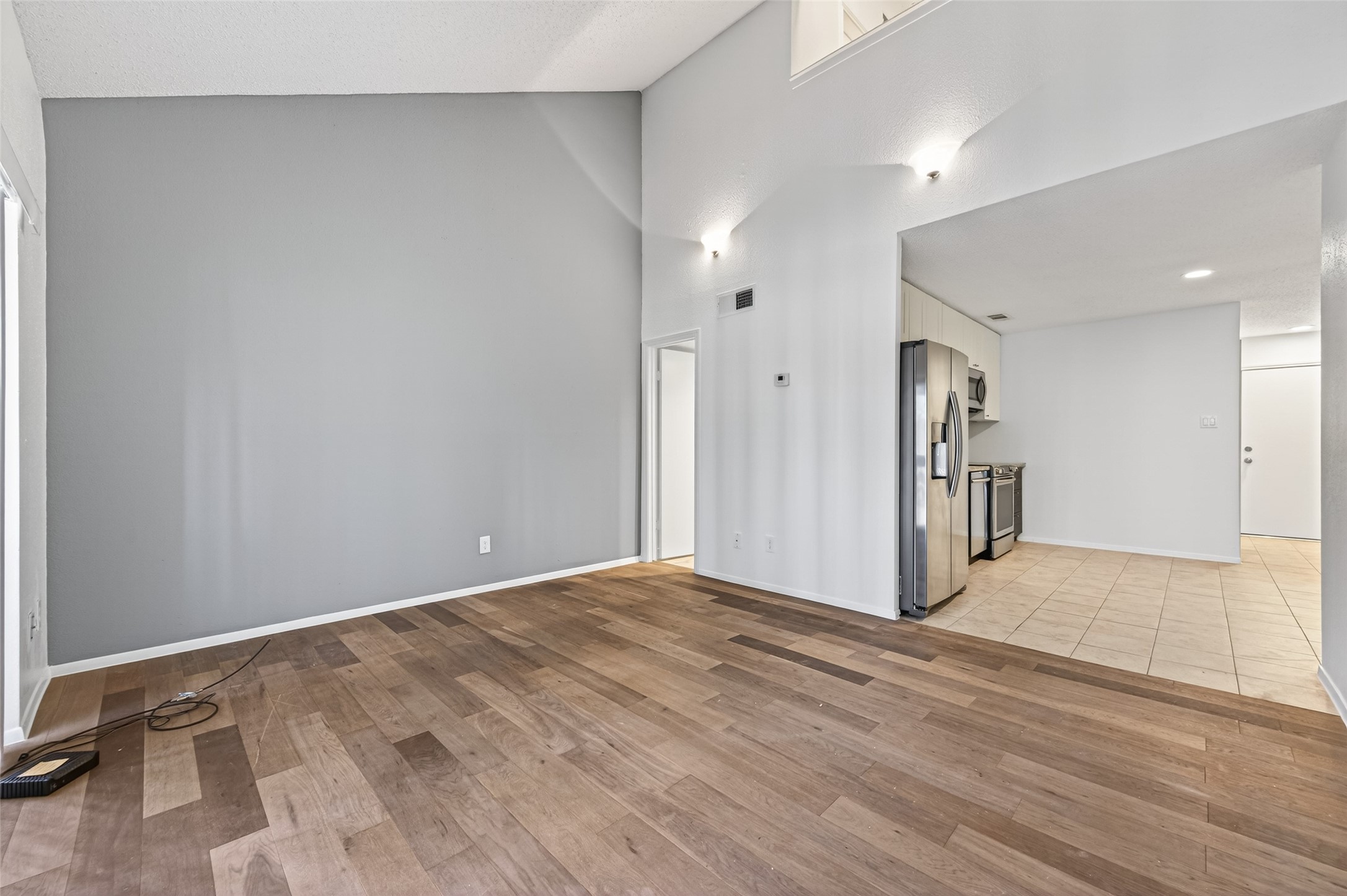12900 Walden Road, Unit 108A Montgomery, TX 77356 - Photo 17 of 42 a view of an empty room and wooden floor