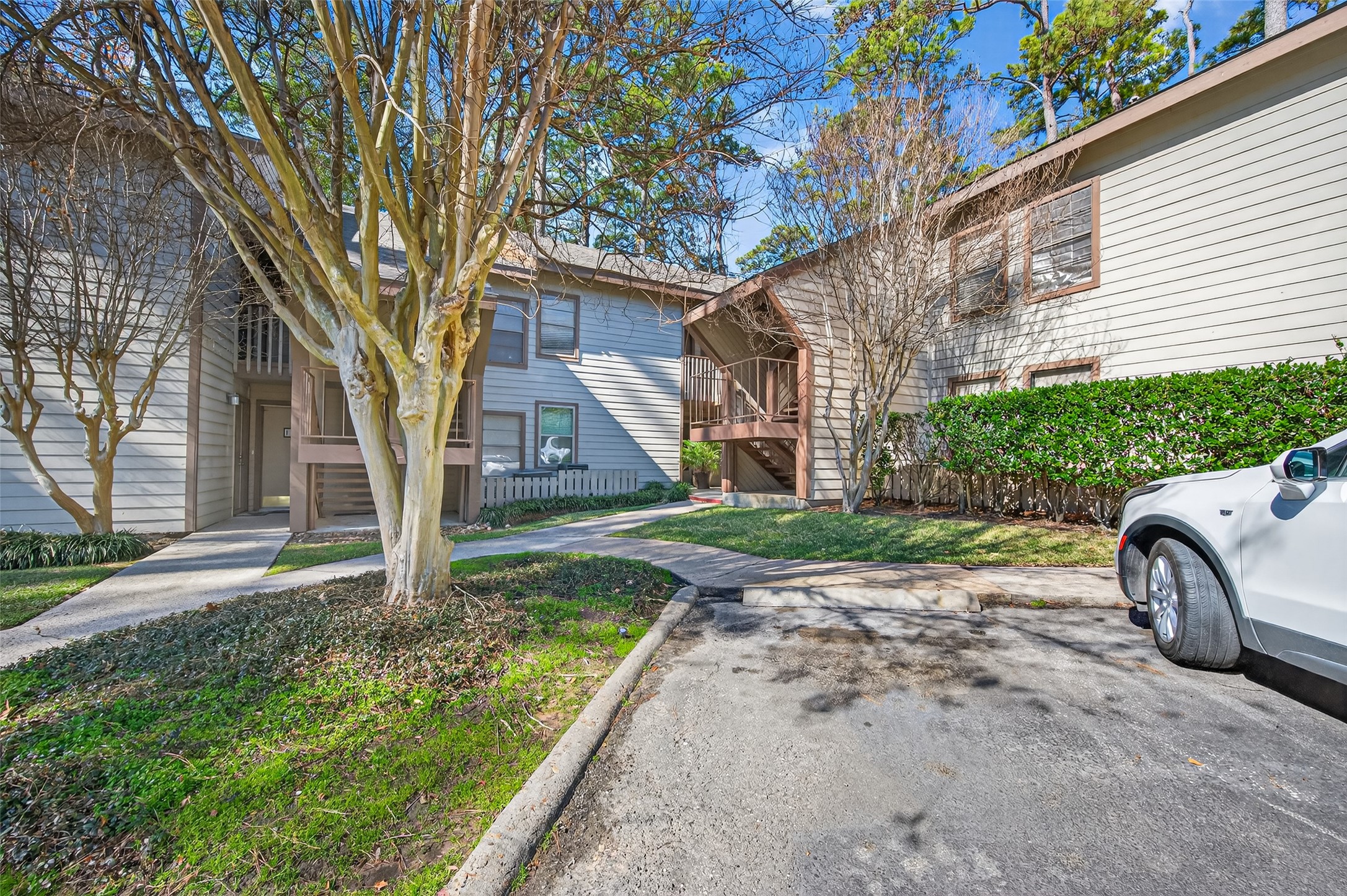 12900 Walden Road, Unit 108A Montgomery, TX 77356 - Photo 2 of 42 a front view of a house with garden