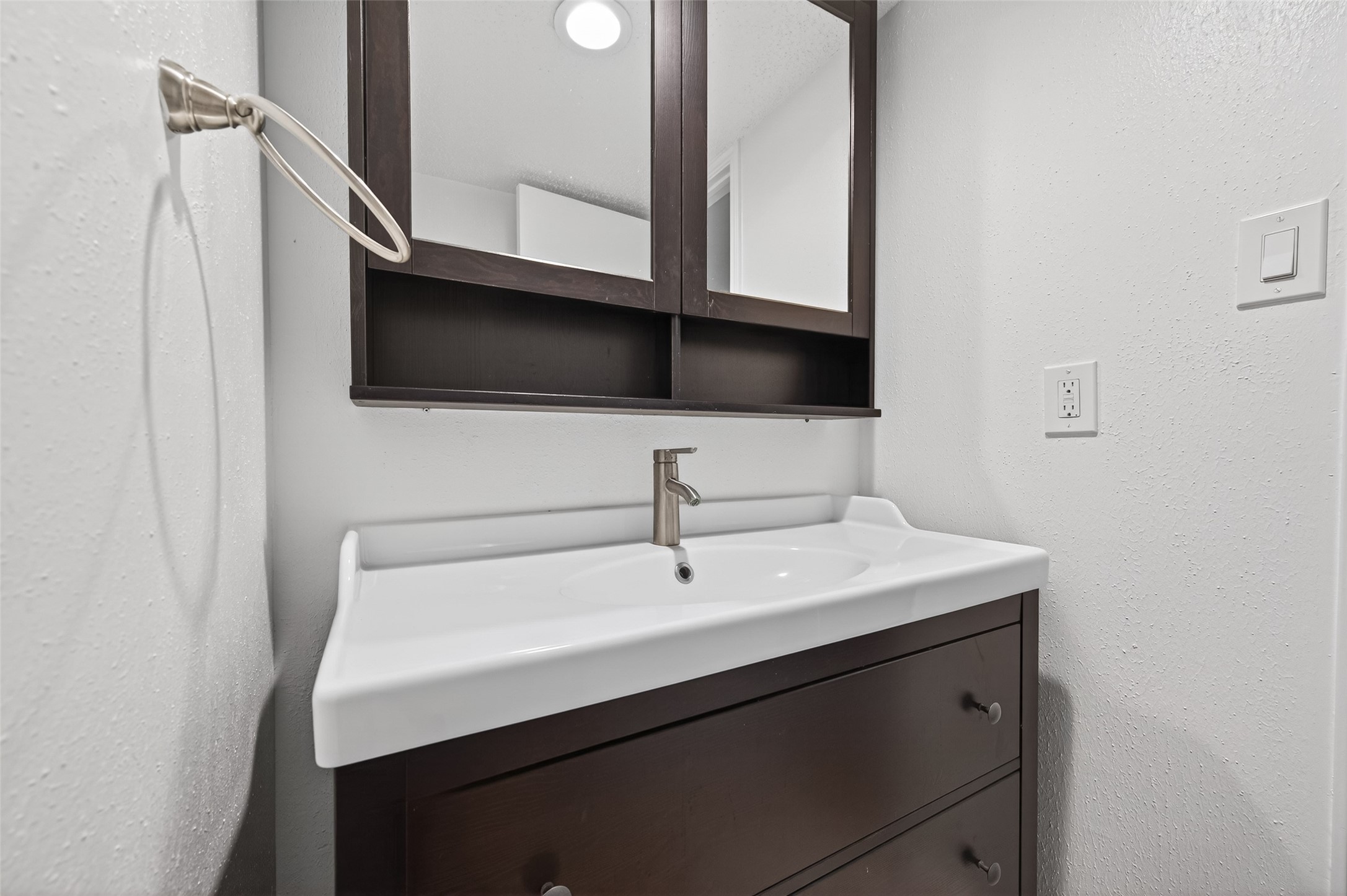 12900 Walden Road, Unit 108A Montgomery, TX 77356 - Photo 23 of 42 a bathroom with a sink and a mirror