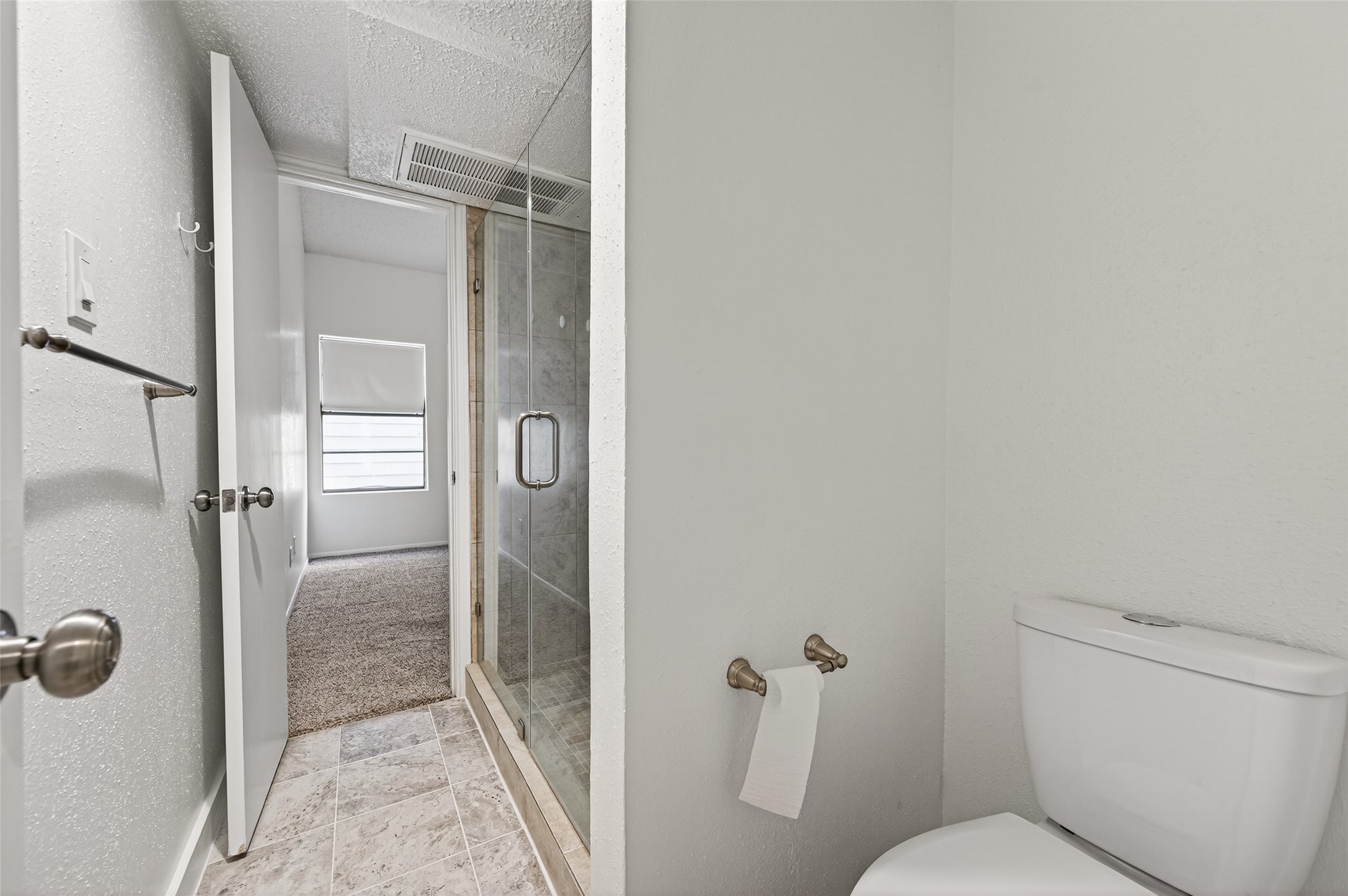 12900 Walden Road, Unit 108A Montgomery, TX 77356 - Photo 24 of 42 a bathroom with a shower and toilet