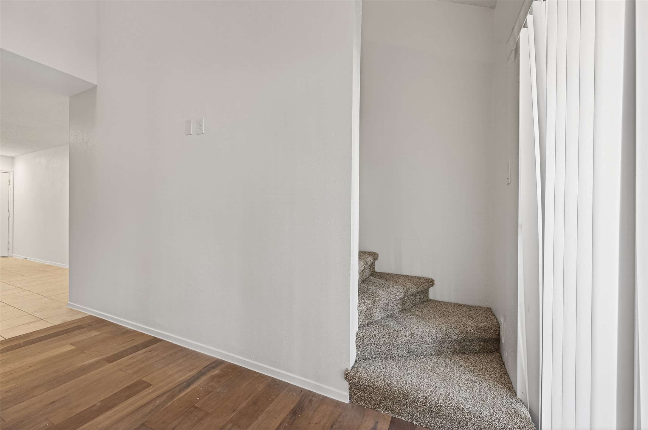 12900 Walden Road, Unit 108A Montgomery, TX 77356 - Photo 29 of 42 a view of a hallway with wooden floor