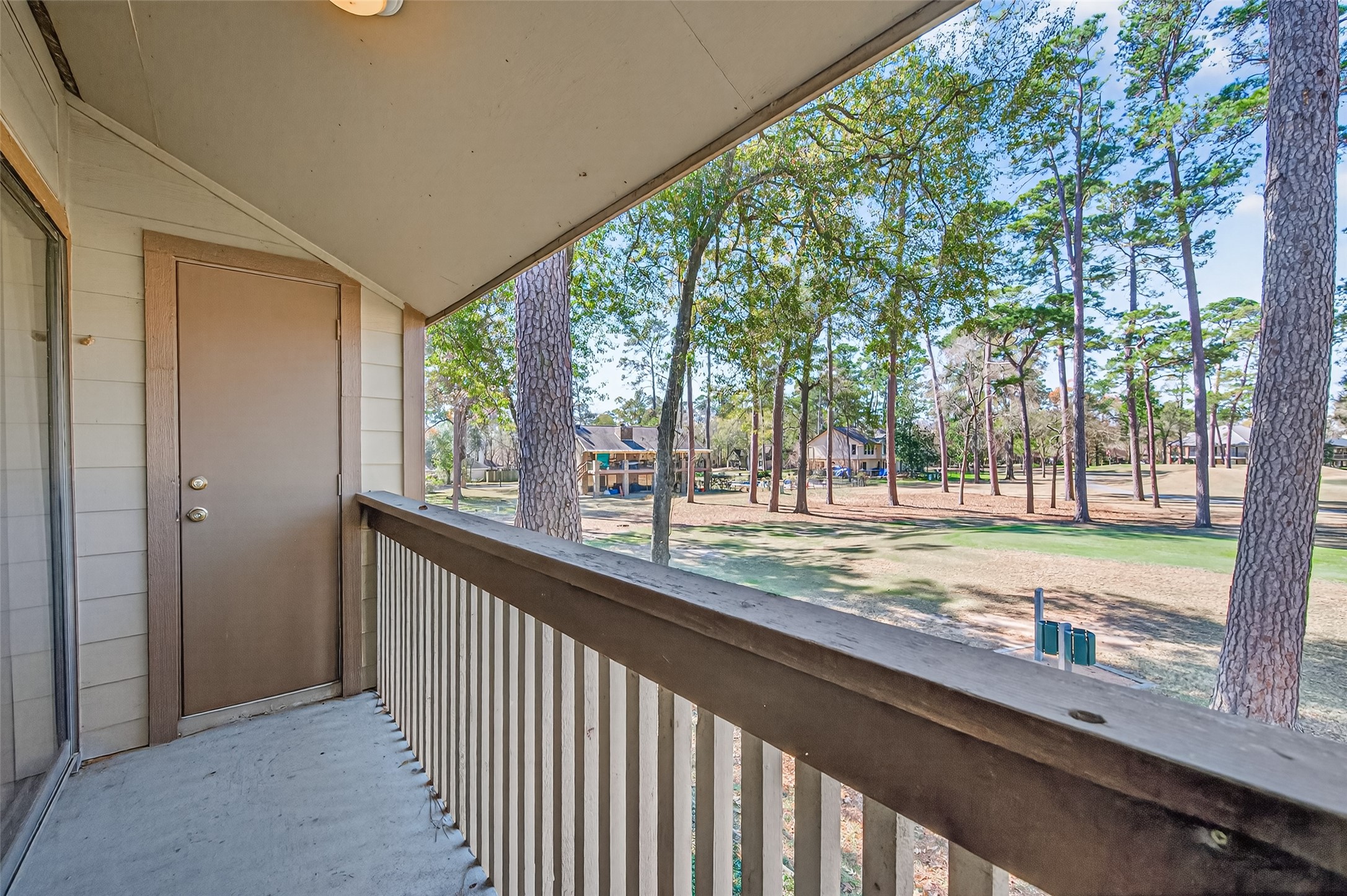12900 Walden Road, Unit 108A Montgomery, TX 77356 - Photo 39 of 42 a view of a room with large windows and tree