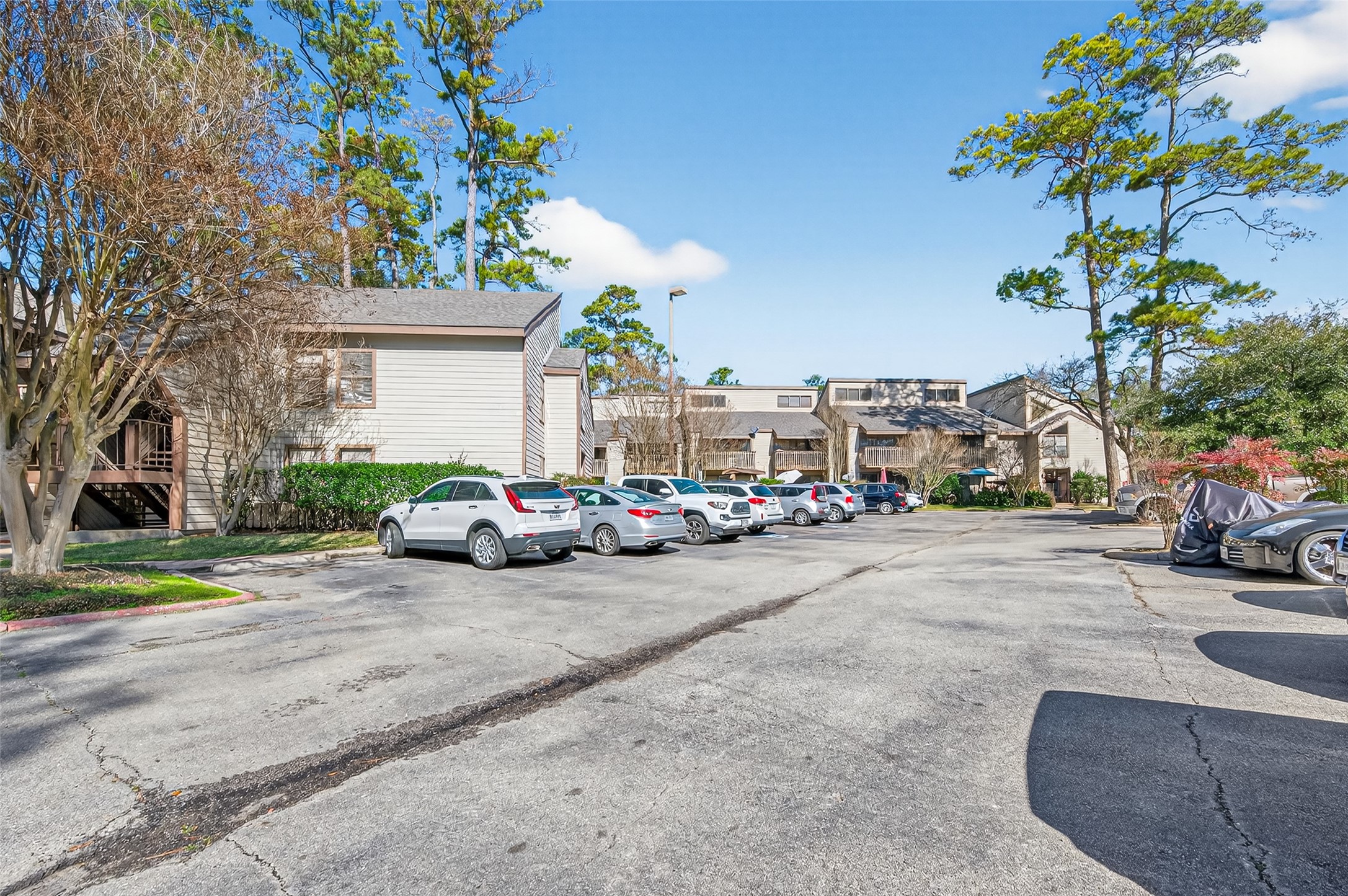 12900 Walden Road, Unit 108A Montgomery, TX 77356 - Photo 5 of 42 a view of a street with a cars park side of a road