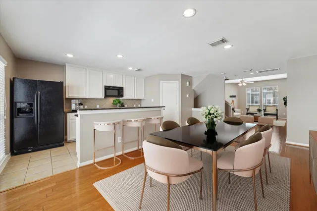 a kitchen with stainless steel appliances kitchen island granite countertop a sink and cabinets