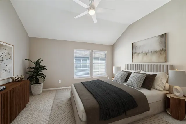 a bedroom with a bed and a potted plant