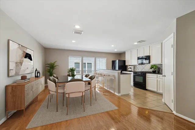 a living room with furniture and kitchen view