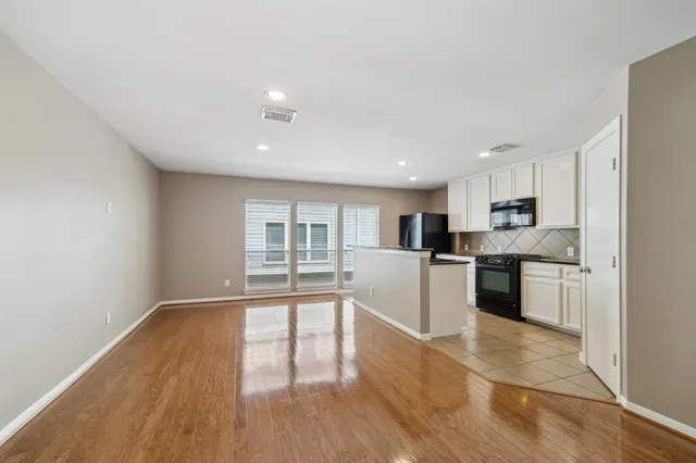a view of kitchen with wooden floor