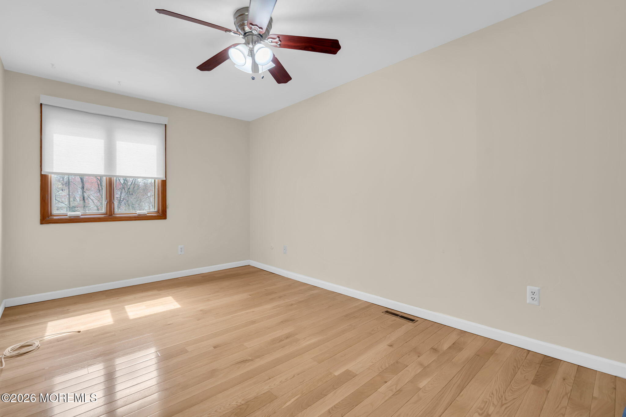 633 Randall Way Aberdeen, NJ 07747 - Photo 15 of 28 wooden floor in an empty room with a window