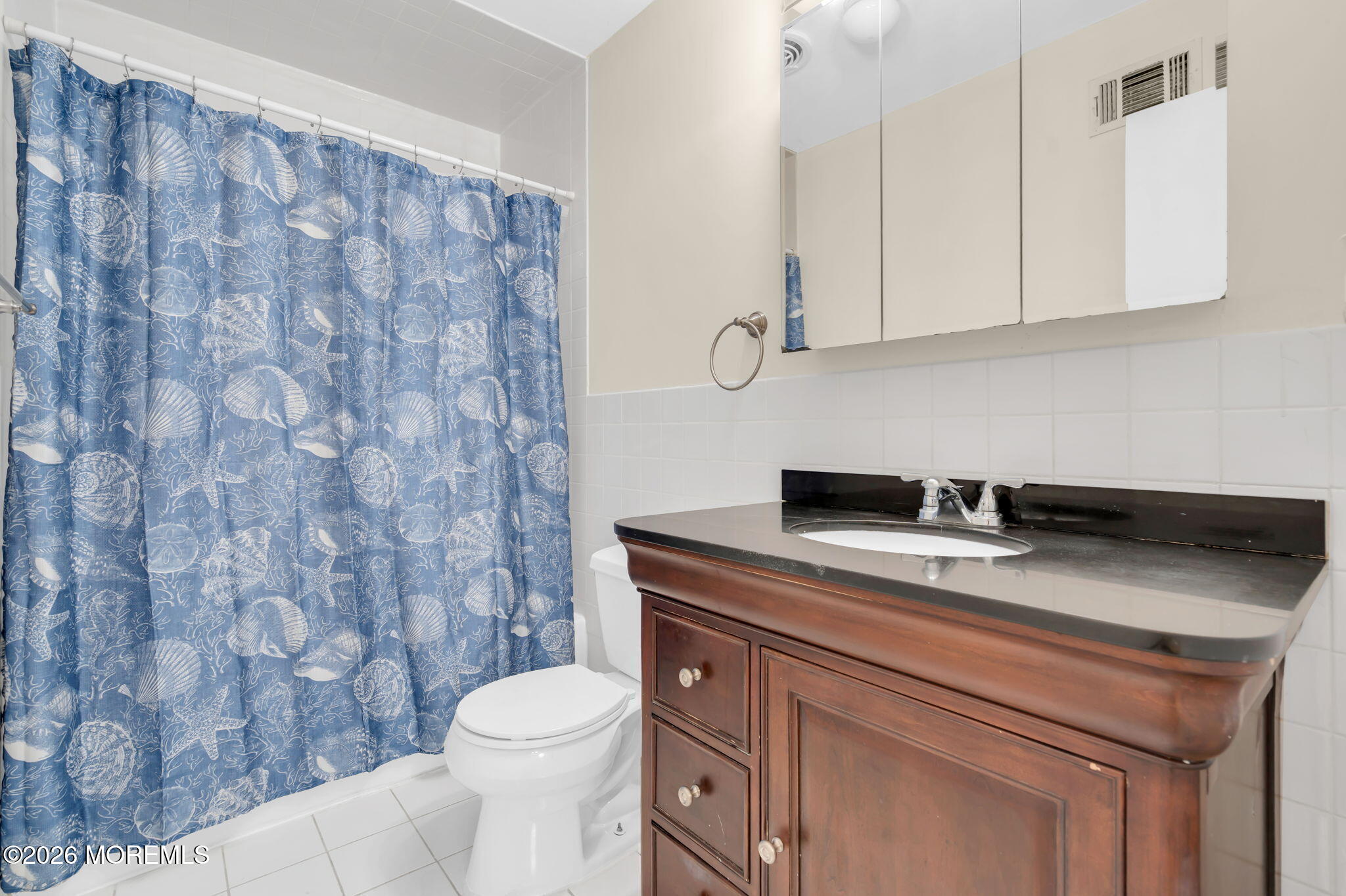 633 Randall Way Aberdeen, NJ 07747 - Photo 17 of 28 a bathroom with a granite countertop toilet sink and mirror