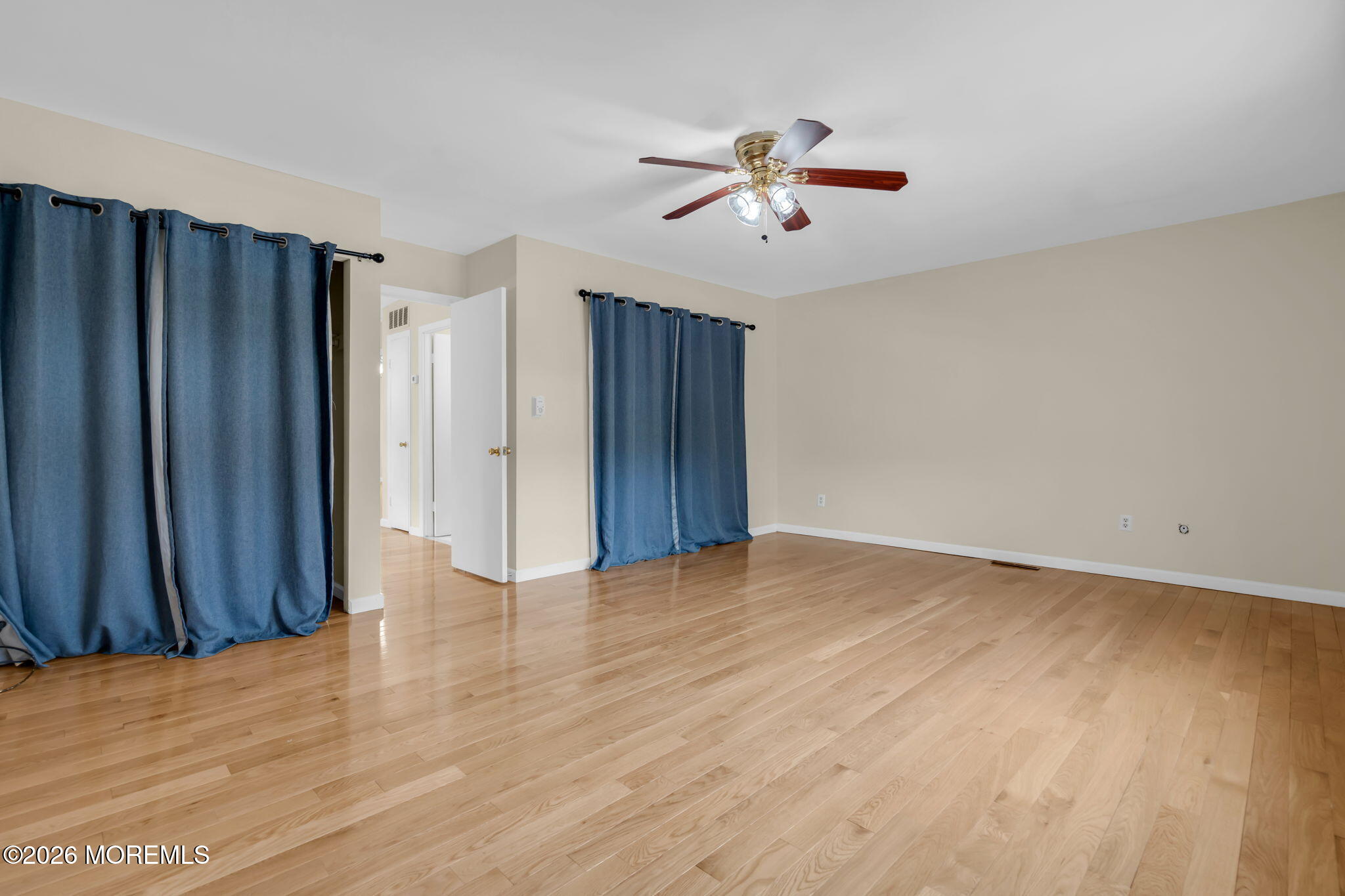 633 Randall Way Aberdeen, NJ 07747 - Photo 21 of 28 a view of an empty room with wooden floor