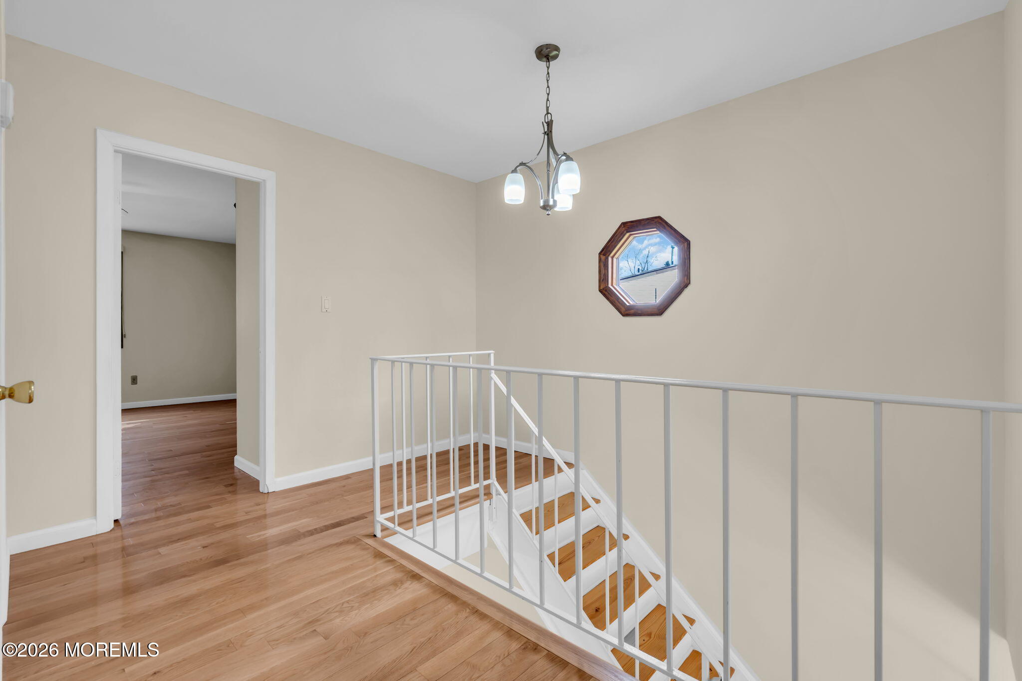 633 Randall Way Aberdeen, NJ 07747 - Photo 25 of 28 a view of a hallway with wooden floor and front door
