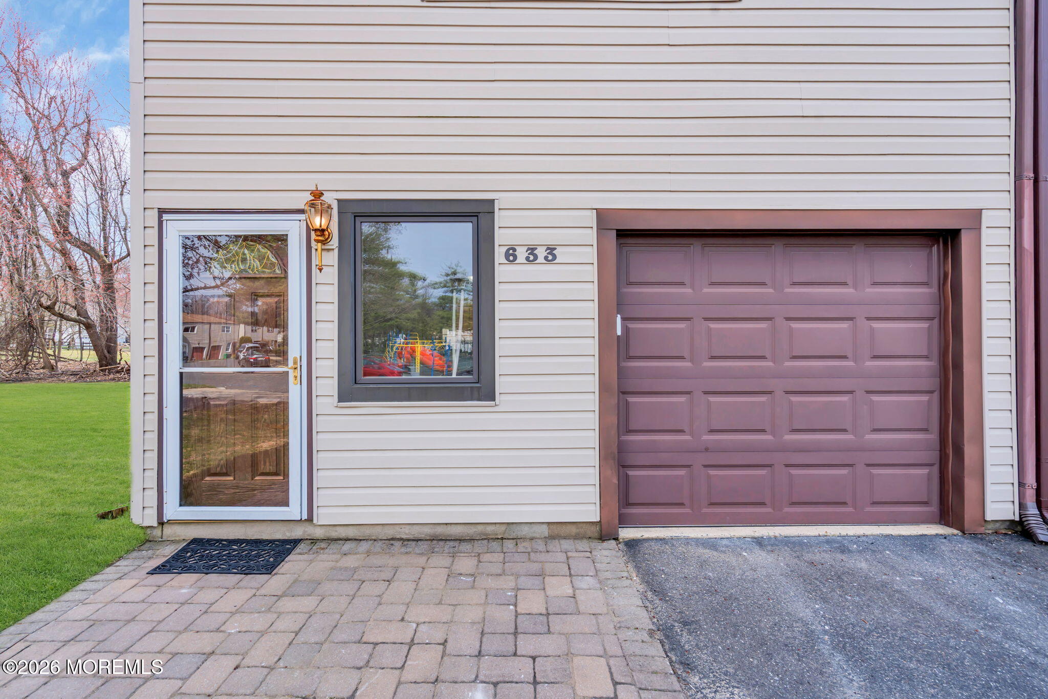633 Randall Way Aberdeen, NJ 07747 - Photo 3 of 28 a view of a brick house with a large window