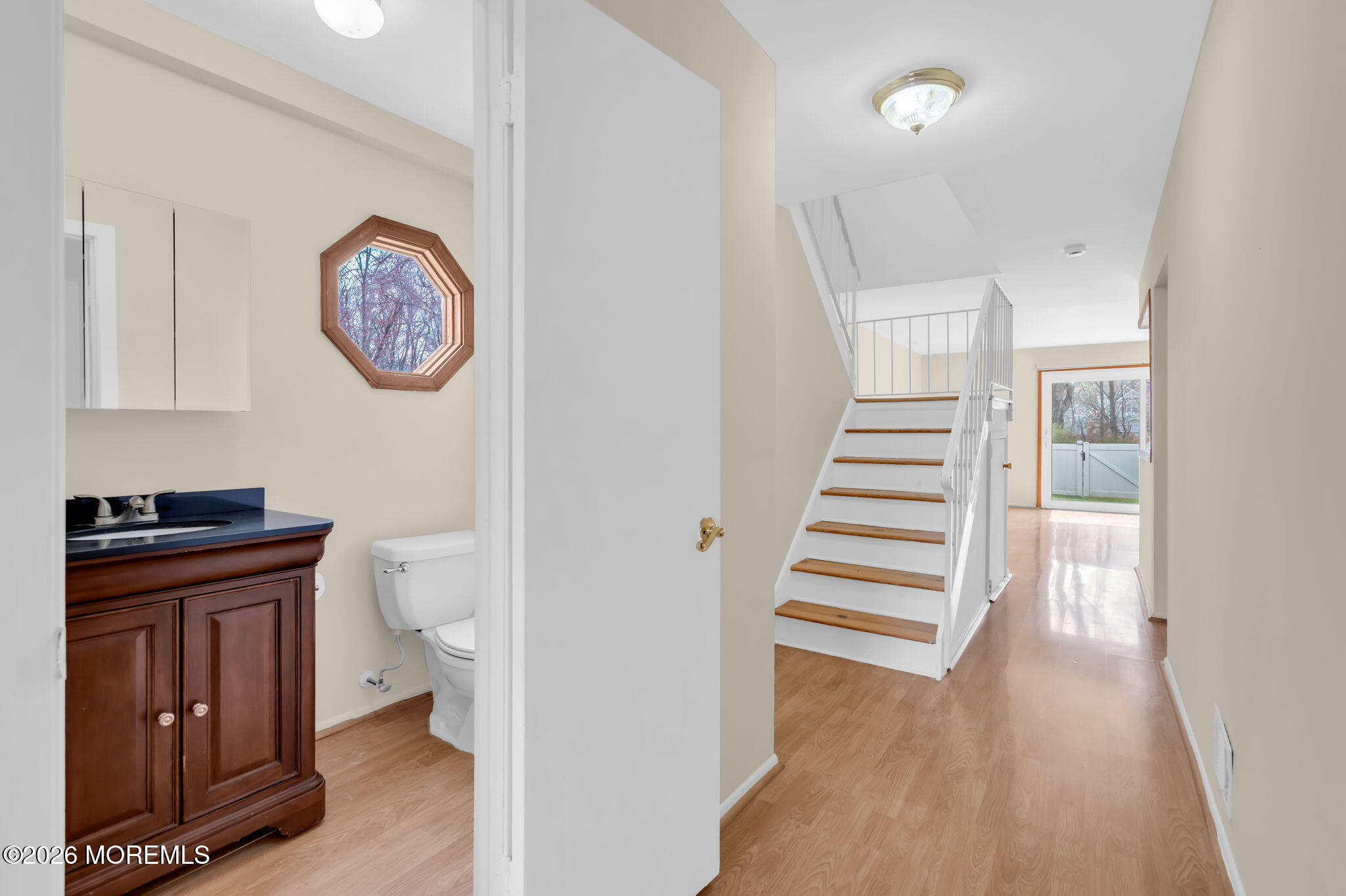 633 Randall Way Aberdeen, NJ 07747 - Photo 6 of 28 a view of a hallway with wooden floor and workspace