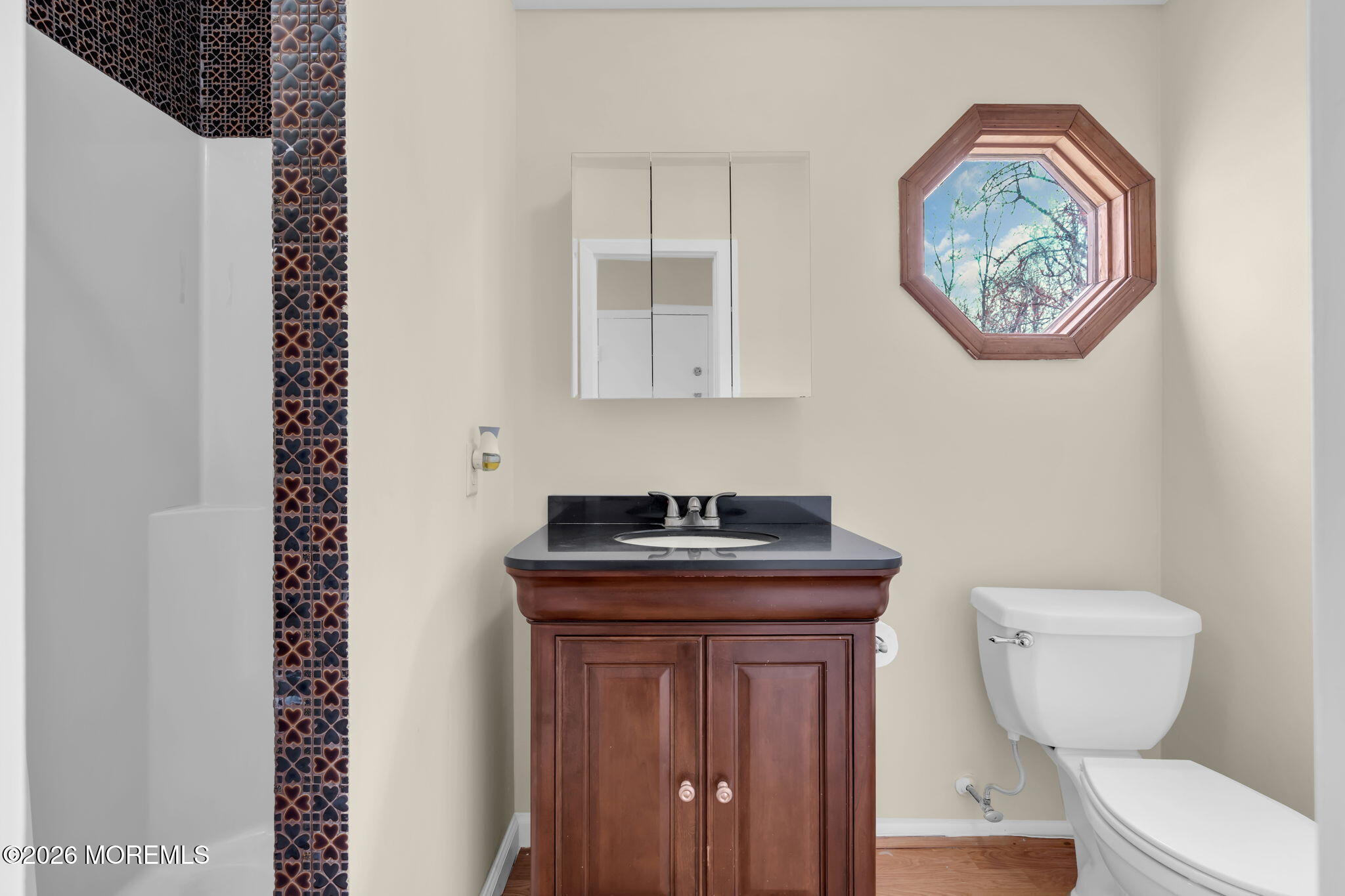 633 Randall Way Aberdeen, NJ 07747 - Photo 7 of 28 a bathroom with a toilet and a sink