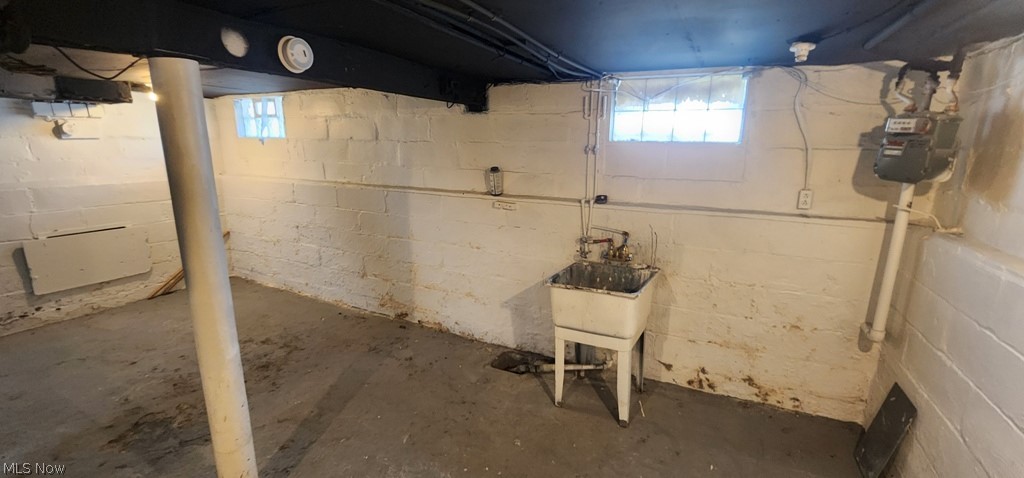 1514 Clermont Road Cleveland, OH 44110 - Photo 13 of 16 Below grade area with a sink and gas meter