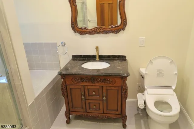 a living room with a fireplace and a floor to ceiling window
