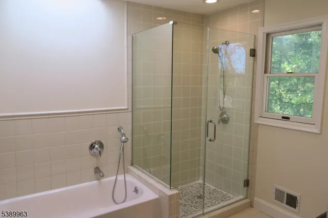 a view of balcony with wooden floor and fence