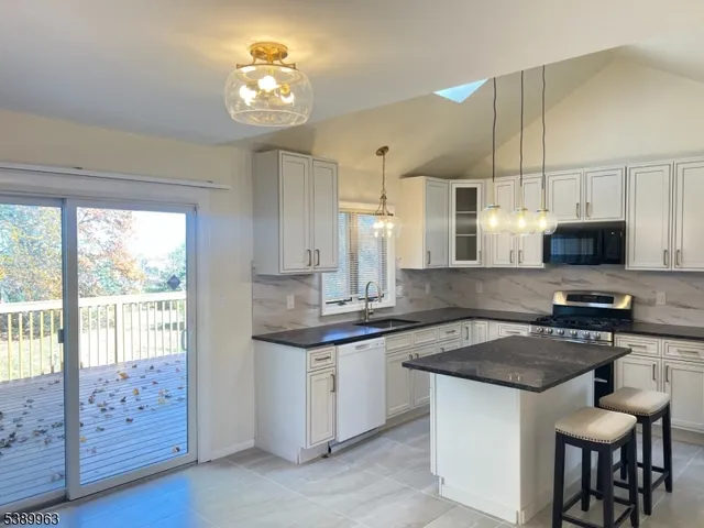 a view of a room with window and wooden floor