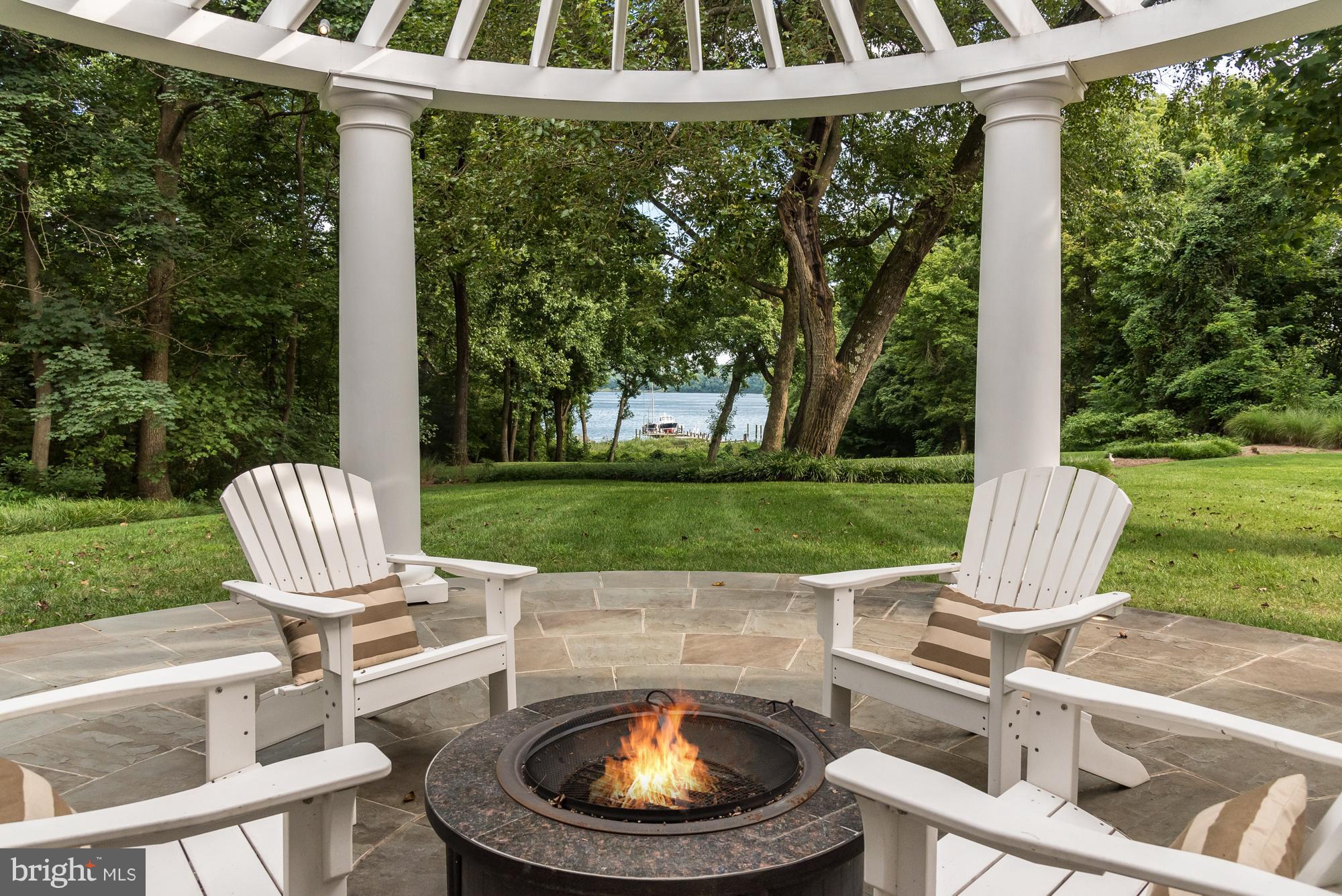 30 Shadow Point Court Edgewater, MD 21037 - Photo 13 of 28 Pergola frames outdoor seating on large Back Porch