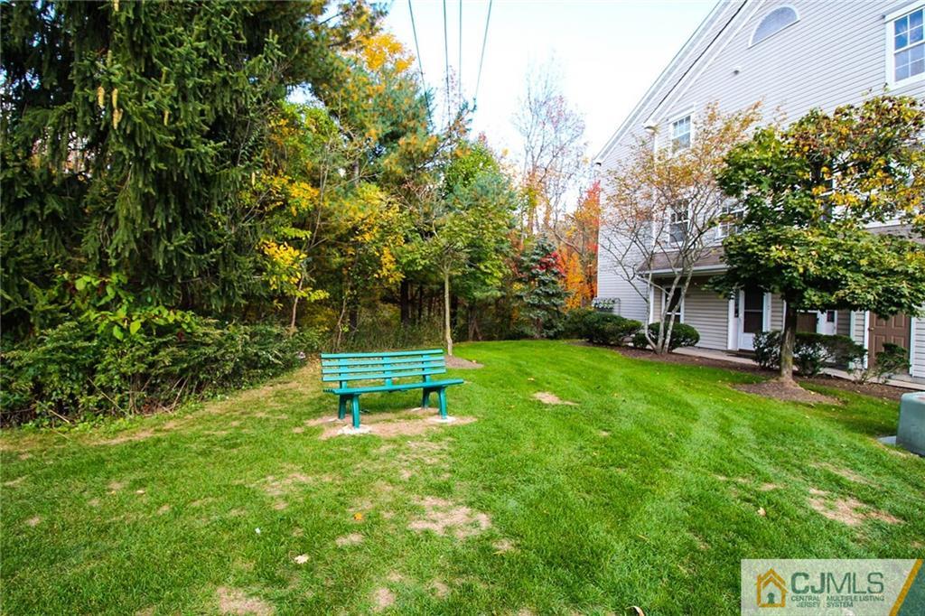 263 Prestwick Way, Unit 263 Edison, NJ 08820 - Photo 4 of 23 a view of a table and chairs in the garden
