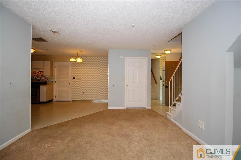 263 Prestwick Way, Unit 263 Edison, NJ 08820 - Photo 8 of 23 an empty room with a bathroom and a sink