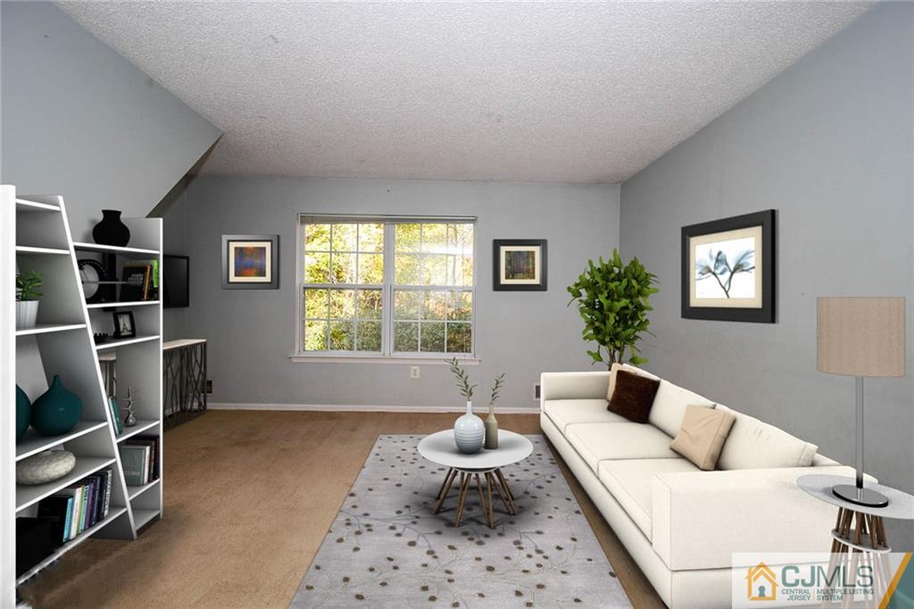 263 Prestwick Way, Unit 263 Edison, NJ 08820 - Photo 9 of 23 a living room with furniture potted plant and a window
